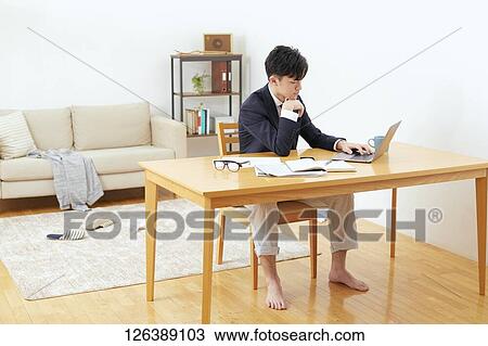Japanese man working from home View Large Photo Image Stock Image - Japanese man working from home. Fotosearch