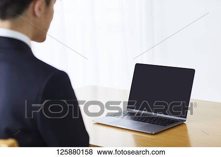 Japanese man working from home View Large Photo Image Stock Photo - Japanese man working from home. Fotosearch
