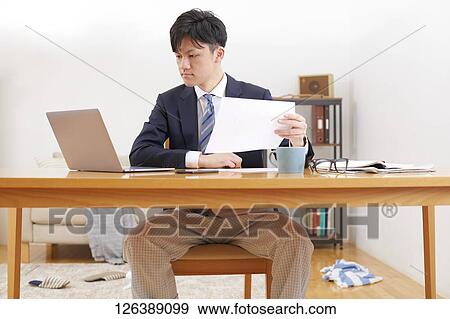 Japanese man working from home View Large Photo Image Stock Photo - Japanese man working from home. Fotosearch