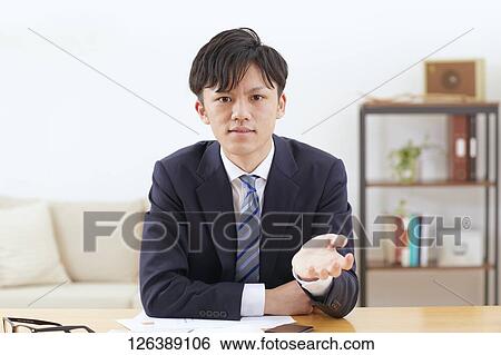 Japanese man working from home View Large Photo Image Stock Photograph - Japanese man working from home. Fotosearch
