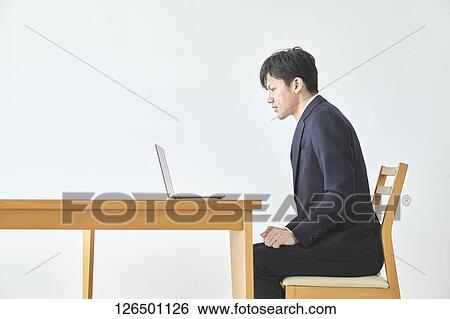 Japanese man working from home View Large Photo Image Stock Photograph - Japanese man working from home. Fotosearch