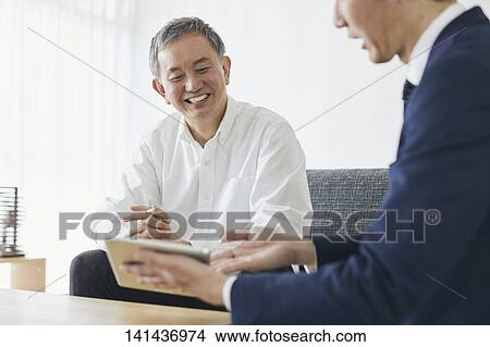 Japanese Middle Aged Man Smiling In The Room View Large Photo Image Picture - Japanese Middle Aged Man Smiling In The Room. Fotosearch