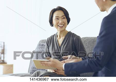 Stock Photo - Japanese Middle Aged Woman Smiling In The Room. Fotosearch
