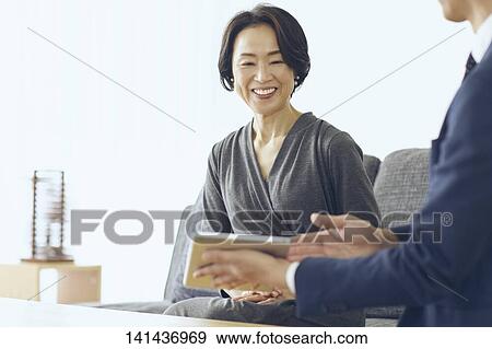 Japanese Middle Aged Woman Smiling In The Room View Large Photo Image Stock Photo - Japanese Middle Aged Woman Smiling In The Room. Fotosearch