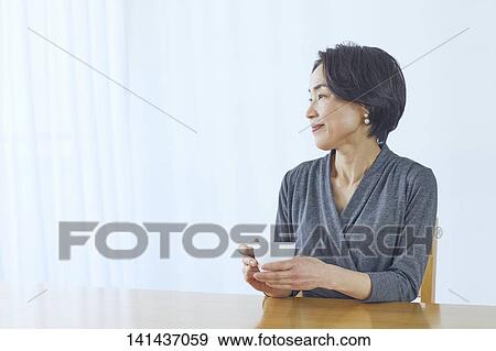 Japanese Middle Aged Woman Smiling In The Room View Large Photo Image Stock Photo - Japanese Middle Aged Woman Smiling In The Room. Fotosearch