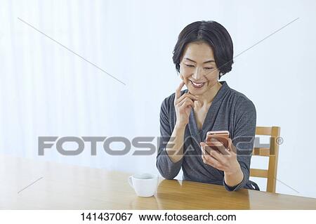 Japanese Middle Aged Woman Smiling In The Room View Large Photo Image Stock Photo - Japanese Middle Aged Woman Smiling In The Room. Fotosearch