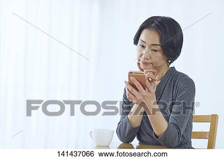 Japanese Middle Aged Woman Smiling In The Room View Large Photo Image Stock Photograph - Japanese Middle Aged Woman Smiling In The Room. Fotosearch