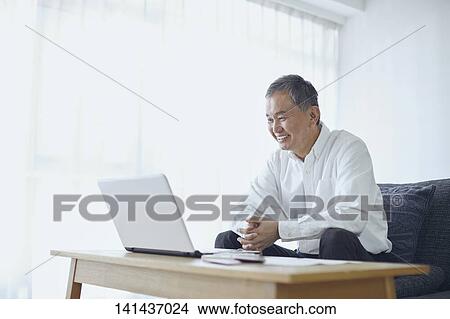 Picture - Japanese Senior At Home. Fotosearch
