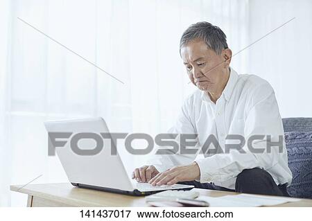Stock Photo - Japanese Senior At Home. Fotosearch