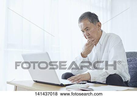 Stock Photo - Japanese Senior At Home. Fotosearch