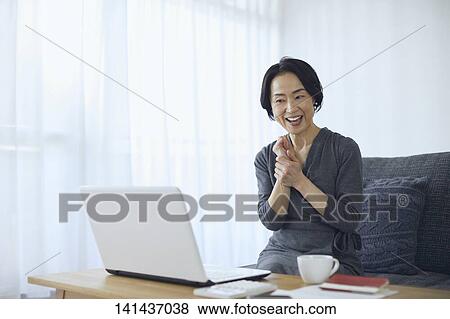 Stock Photo - Japanese Senior At Home. Fotosearch