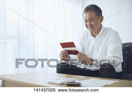 Stock Photograph - Japanese Senior At Home. Fotosearch