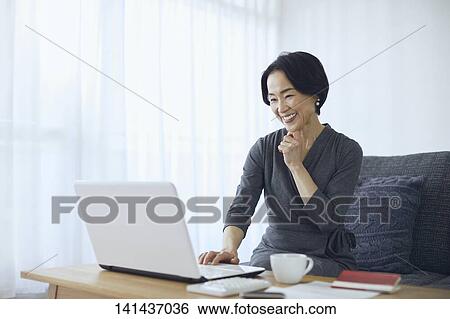 Stock Photograph - Japanese Senior At Home. Fotosearch