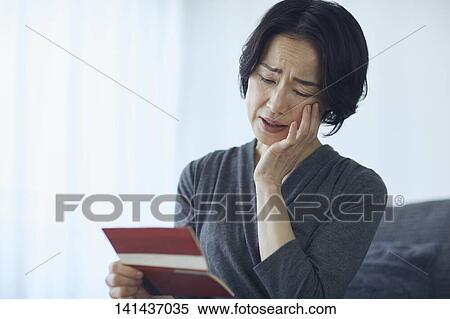 Stock Photography - Japanese Senior At Home. Fotosearch