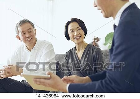 Picture - Japanese Senior Couple In The Room. Fotosearch