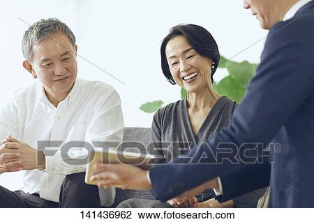 Stock Image - Japanese Senior Couple In The Room. Fotosearch