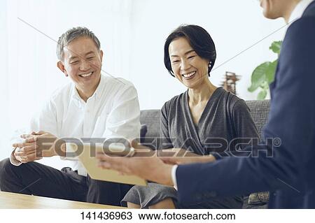 Stock Image - Japanese Senior Couple In The Room. Fotosearch