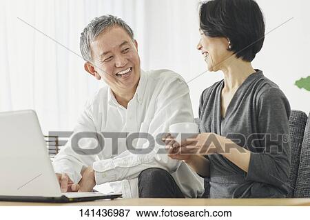 Stock Photo - Japanese Senior Couple In The Room. Fotosearch