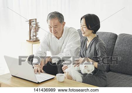 Stock Photo - Japanese Senior Couple In The Room. Fotosearch