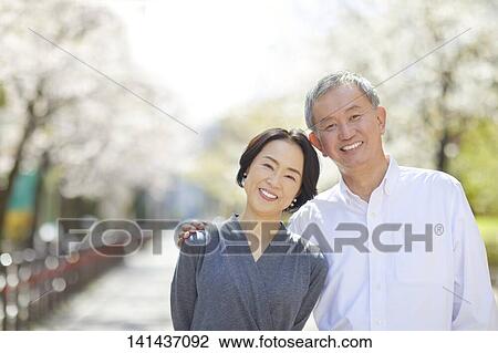 Japanese Senior Couple Smiling Outside View Large Photo Image Stock Image - Japanese Senior Couple Smiling Outside. Fotosearch