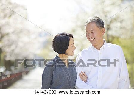 Japanese Senior Couple Smiling Outside View Large Photo Image Stock Photo - Japanese Senior Couple Smiling Outside. Fotosearch