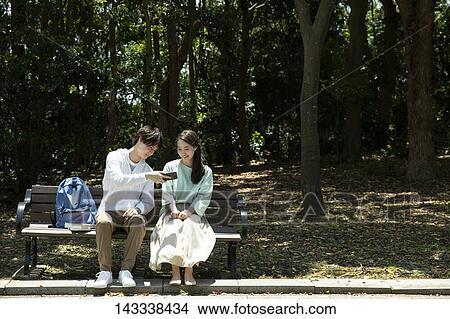Japanese university students at a city park View Large Photo Image Picture - Japanese university students at a city park. Fotosearch