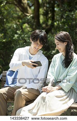 Japanese university students at a city park View Large Photo Image Stock Photo - Japanese university students at a city park. Fotosearch