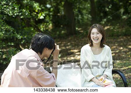 Japanese university students at a city park View Large Photo Image Stock Photo - Japanese university students at a city park. Fotosearch