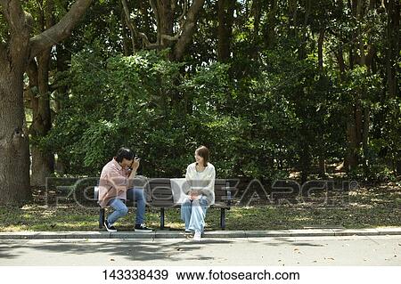 Stock Photo - Japanese university students at a city park. Fotosearch