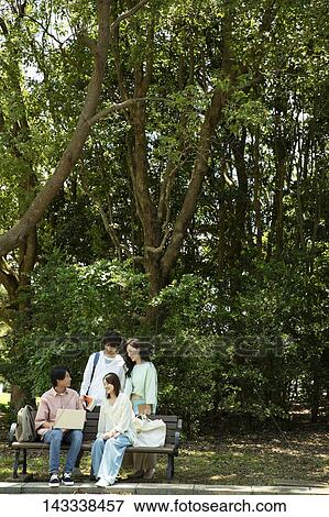 Japanese university students at a city park View Large Photo Image Stock Photo - Japanese university students at a city park. Fotosearch