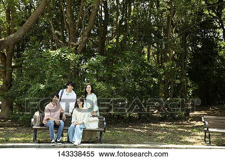 Stock Photography - Japanese university students at a city park. Fotosearch