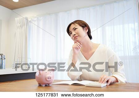 Stock Image - Japanese woman at home. Fotosearch