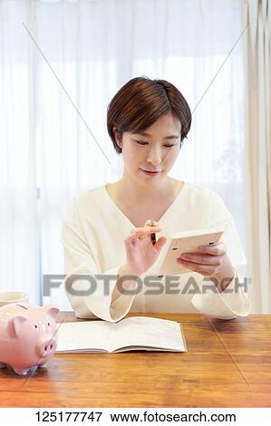 Stock Photo - Japanese woman at home. Fotosearch