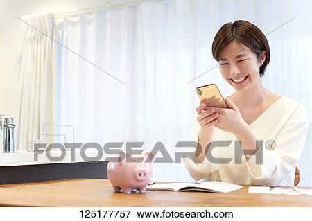 Japanese woman at home View Large Photo Image Stock Photo - Japanese woman at home. Fotosearch