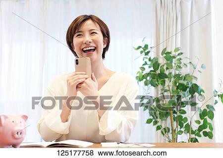 Stock Photo - Japanese woman at home. Fotosearch