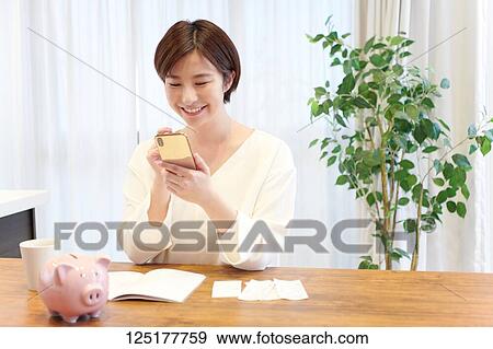 Stock Photo - Japanese woman at home. Fotosearch