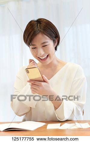 Japanese woman at home View Large Photo Image Stock Photography - Japanese woman at home. Fotosearch