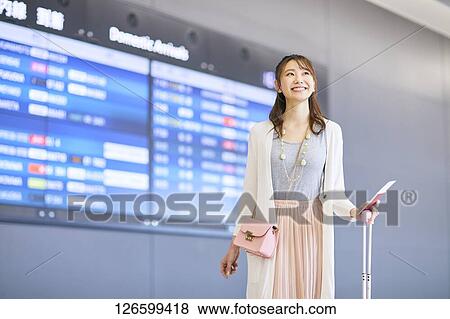 Stock Photo - Japanese woman at the airport. Fotosearch