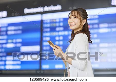 Japanese woman at the airport View Large Photo Image Stock Photography - Japanese woman at the airport. Fotosearch