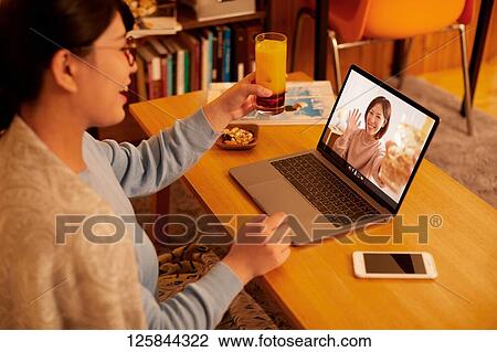 Japanese woman drinking at home remote drinking View Large Photo Image Stock Image - Japanese woman drinking at home remote drinking. Fotosearch