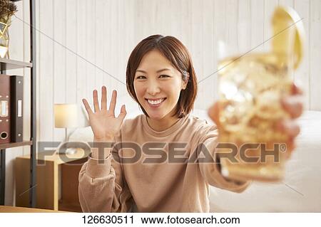 Japanese woman drinking at home remote drinking View Large Photo Image Stock Image - Japanese woman drinking at home remote drinking. Fotosearch