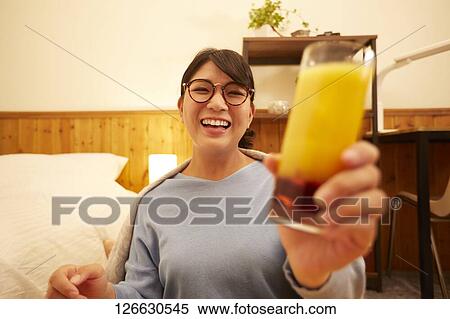 Japanese woman drinking at home remote drinking View Large Photo Image Stock Photography - Japanese woman drinking at home remote drinking. Fotosearch