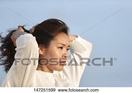 Stock Photo - Japanese woman outside. Fotosearch