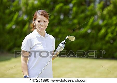 Japanese woman practicing golf in the garden View Large Photo Image Stock Image - Japanese woman practicing golf in the garden. Fotosearch