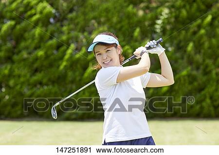 Japanese woman practicing golf in the garden View Large Photo Image Stock Image - Japanese woman practicing golf in the garden. Fotosearch