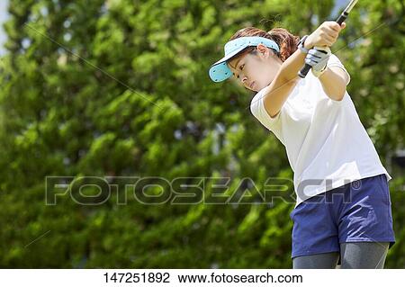 Japanese woman practicing golf in the garden View Large Photo Image Stock Image - Japanese woman practicing golf in the garden. Fotosearch