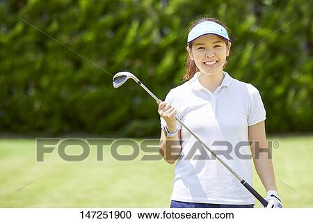 Japanese woman practicing golf in the garden View Large Photo Image Stock Image - Japanese woman practicing golf in the garden. Fotosearch