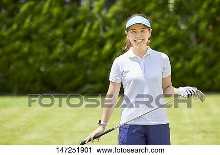 Japanese woman practicing golf in the garden View Large Photo Image Stock Image - Japanese woman practicing golf in the garden. Fotosearch