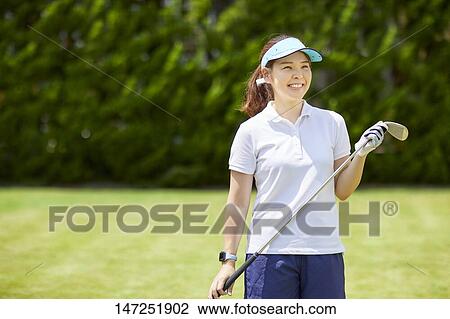 Japanese woman practicing golf in the garden View Large Photo Image Stock Image - Japanese woman practicing golf in the garden. Fotosearch