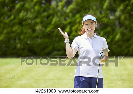 Japanese woman practicing golf in the garden View Large Photo Image Stock Image - Japanese woman practicing golf in the garden. Fotosearch